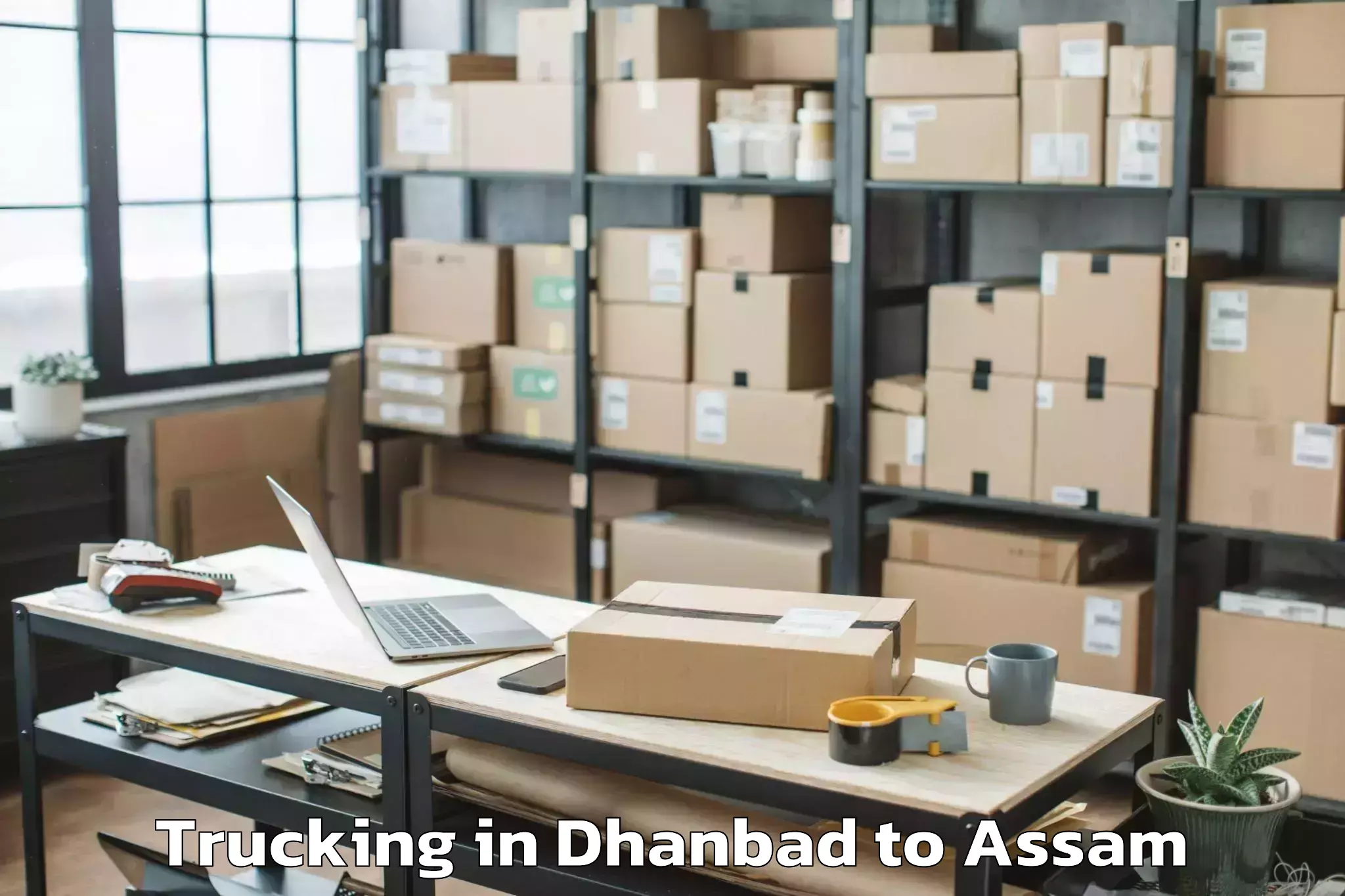 Book Dhanbad to Banekuchi Trucking